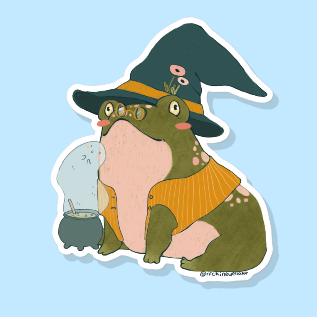 A picture of a sorcerer toad sticker sitting on a blue background. the toad wears a witch hat and a yellow vest with a little cauldron in front of him.