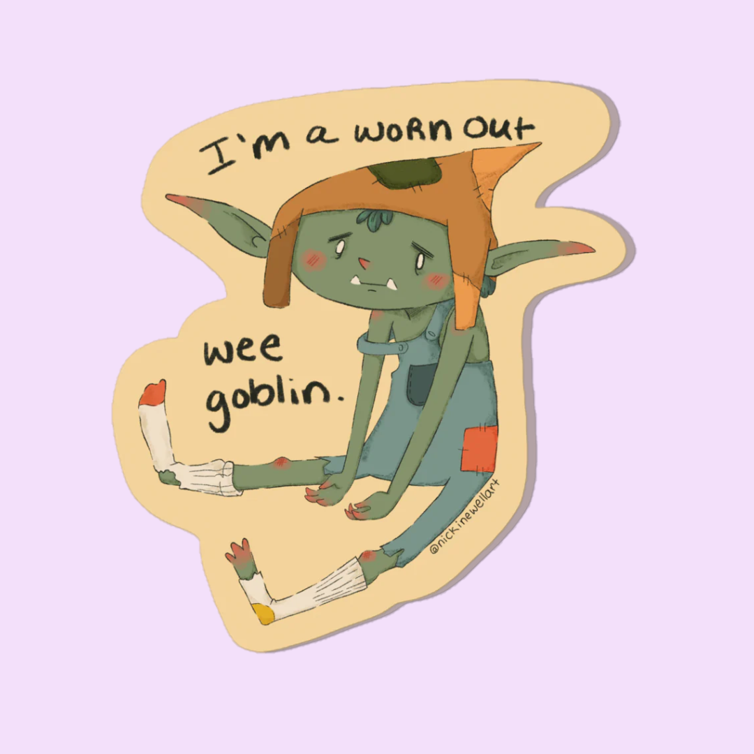 A picture of a sticker that is a little goblin sitting a bit exasperated on the ground. He is wearing some dungarees and socks with holes in them. the sticker says "I'm a worn out wee goblin."